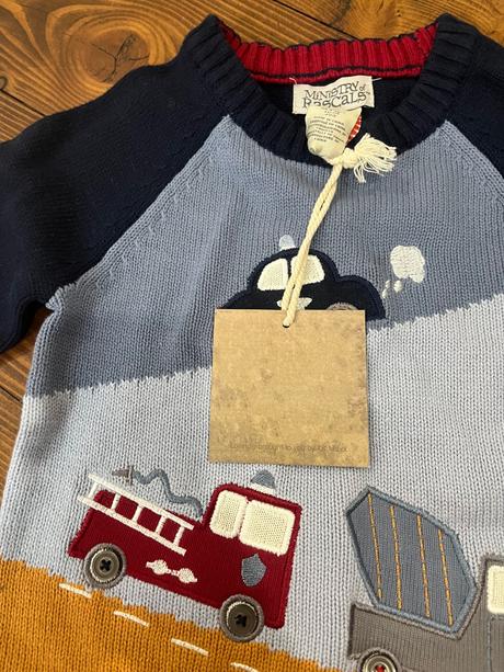 Svetrík s autami, 98