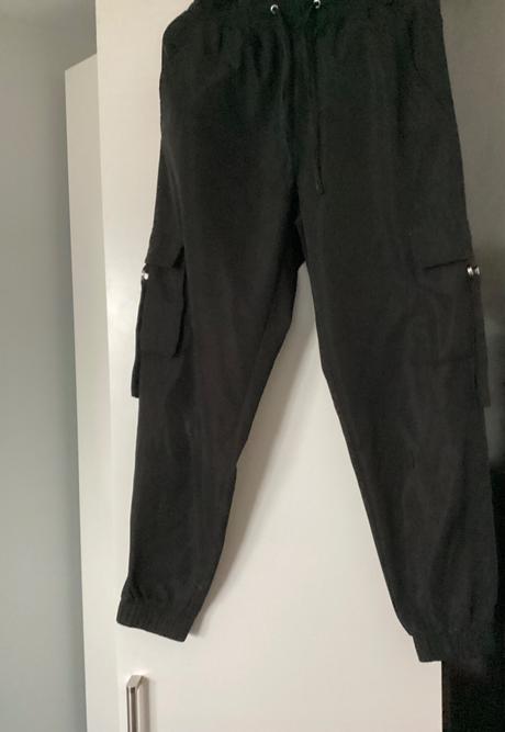 Kapsacove tepláky s poškodením, s