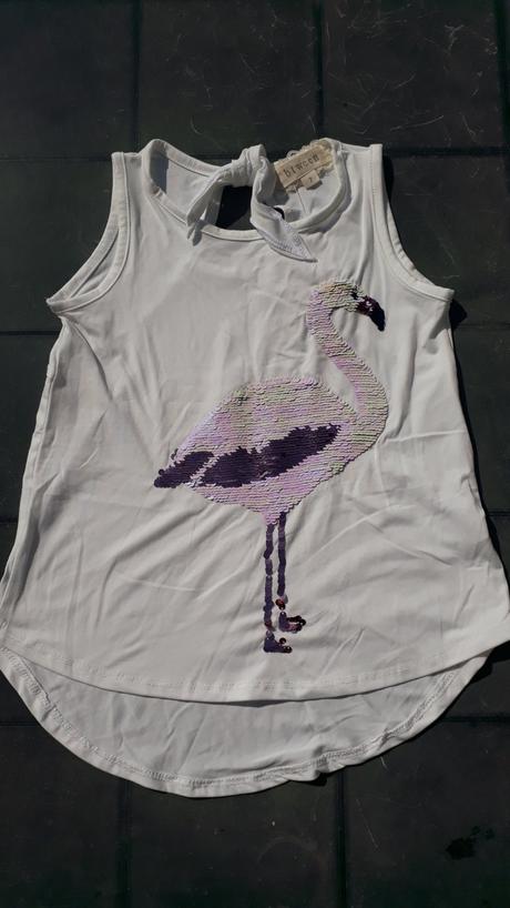 Tielko s plameniakom, 122