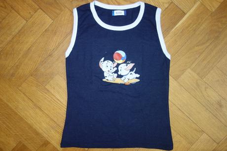 Tielko psíkovia s loptou, 134