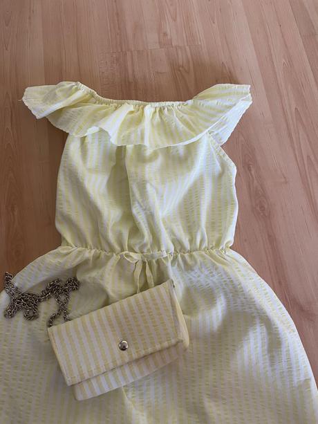 Šaty s kabelkou, 134