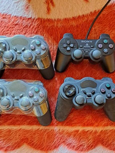 Herná konzola ps2 + hry 7 ks,