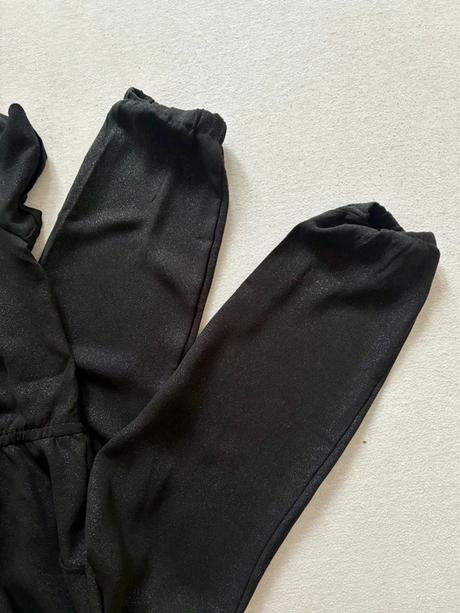 Trblietavý overal, 164