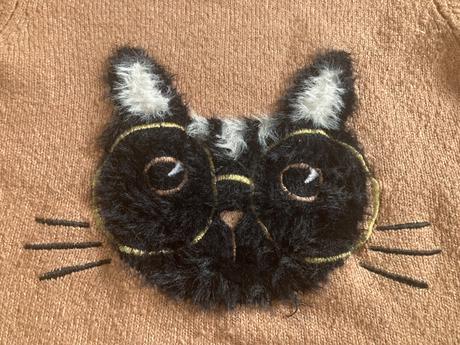 Sveter s mačkou, 134