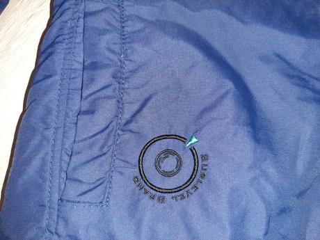 Bunda so šikmím zapínaním sublevel, s