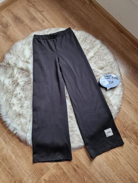 Široké vrubkove nohavice, 164