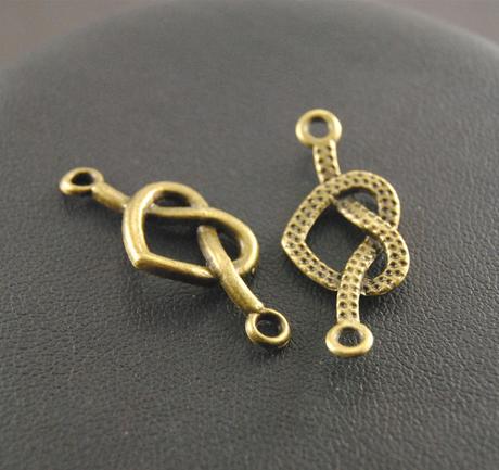 Prívesok - konektor zapletené srdce 33x14mm bronz, 
