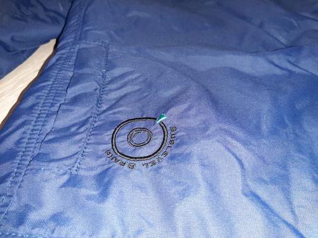 Bunda so šikmím zapínaním sublevel, s