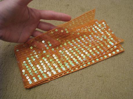 Flitrovaný oranžový opasok,