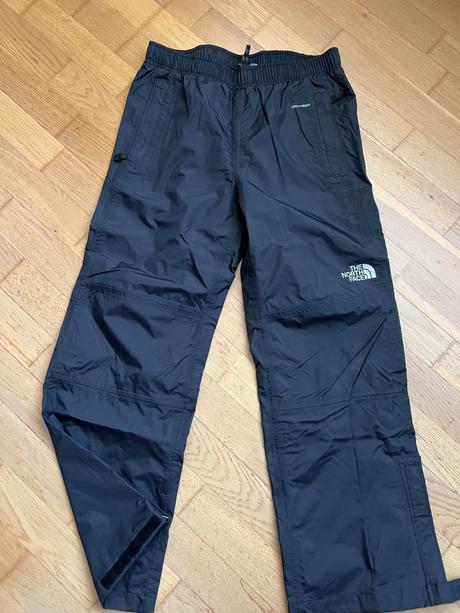 Nové šušťákové nohavice the north face, l
