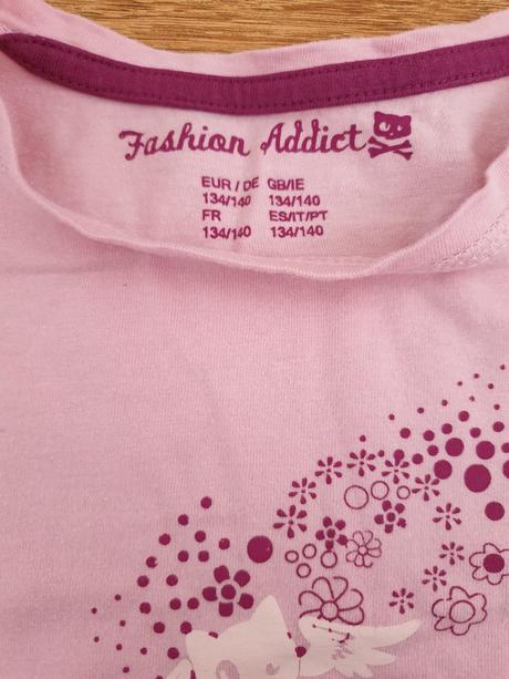 Bledoružový pulóver, 134