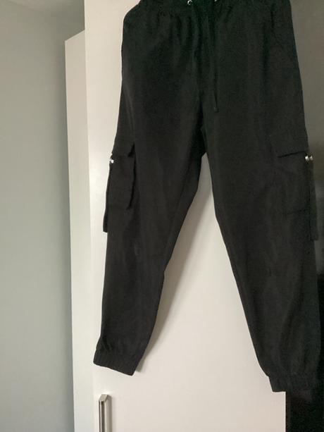 Kapsacove tepláky s poškodením, s