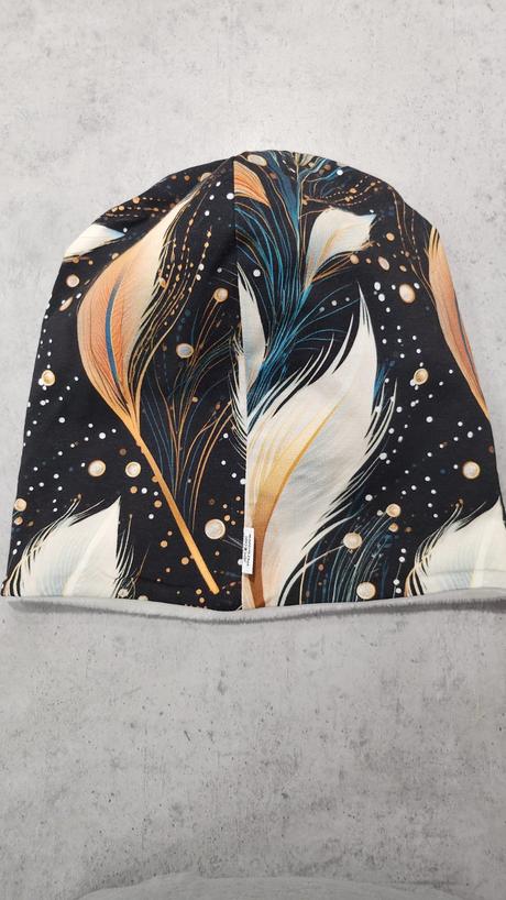 Čiapka pávie perá,
