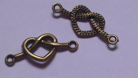 Prívesok - konektor zapletené srdce 33x14mm bronz, 