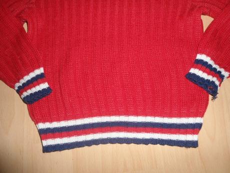 Cerveny svetrik, 122