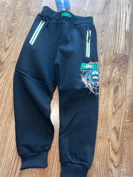 Vyteplene teplaky s reflexnym pasikom, 116