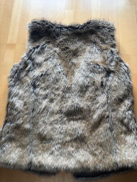 Teplá dámska kožušinová vesta m/40-42, 42