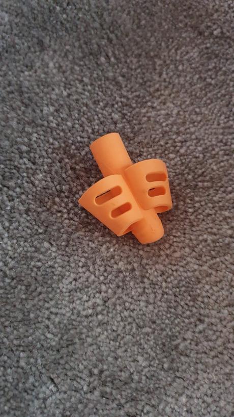 Náprstok na správne držanie pera a ceruzky,