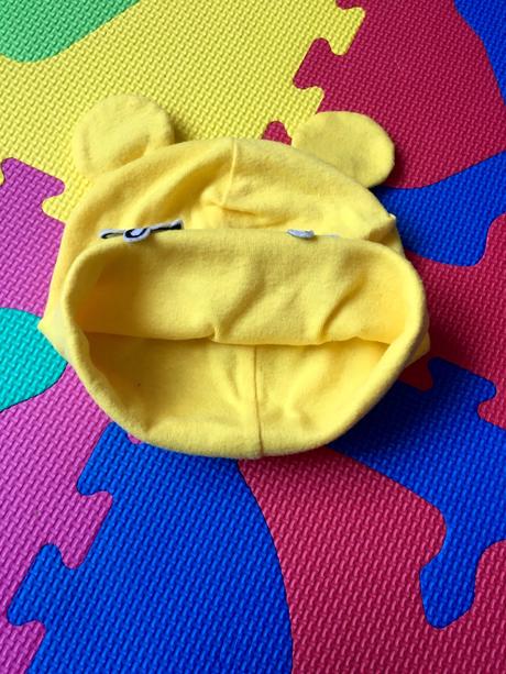 Žltá prechodná čiapka s rúčkami a uškami, 74