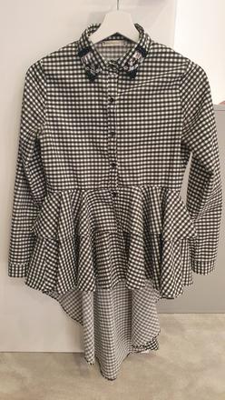 Predĺžená košeľa, 34