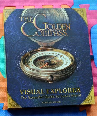 Golden compass essential guide to lyra's world - a,
