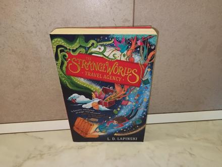 L d lapinski - the strange worlds travel agency,