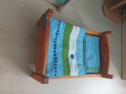 Drevena postielka pre babiku, 