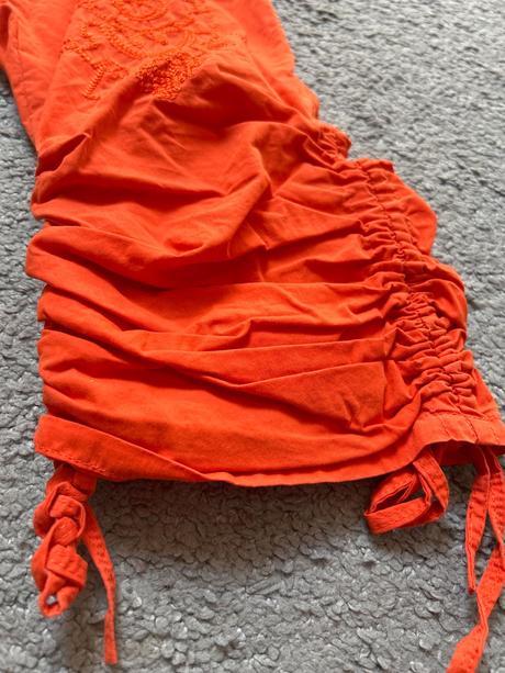 Nohavice oranžové, s