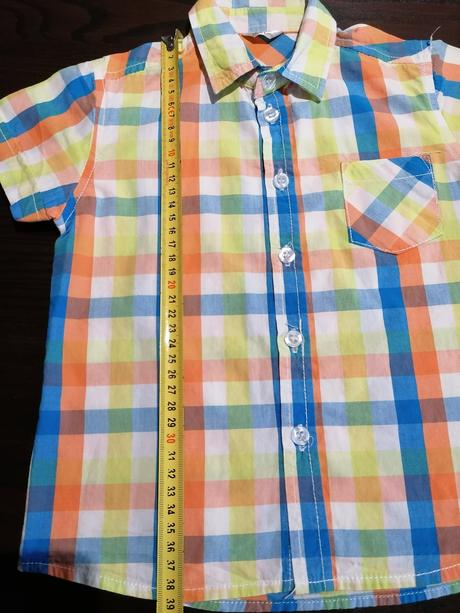 Oranzovkasta košeľa, 92