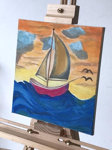 Maľba plachetnica pri západe slnka,