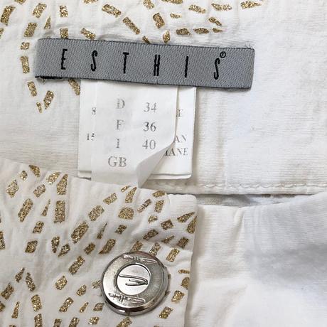 Esthis biela  mini sukňa so zlatou potlačou, xs