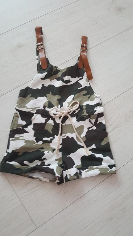 Maskacovy overal, 98