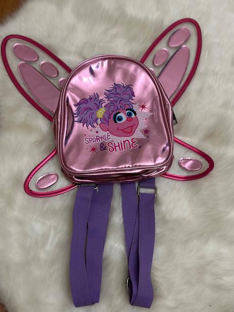 Detský ružový ruksak abby cadabby s krídlami, 