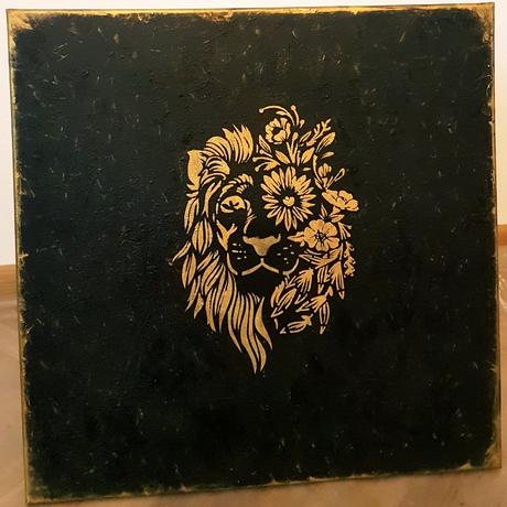 Obraz zlatý lev na čiernej,