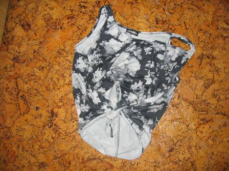 Tielko na zaväzovanie, l