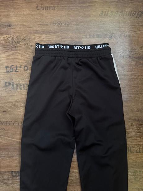 Čierne tepláky s cvokmi, takko,146