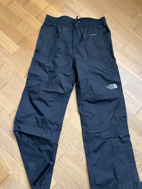 Nové šušťákové nohavice the north face, l