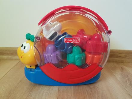 Hudobny slimak s kockami fisher price, 