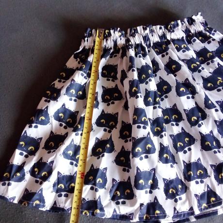 Sukňa s mačkami, 134