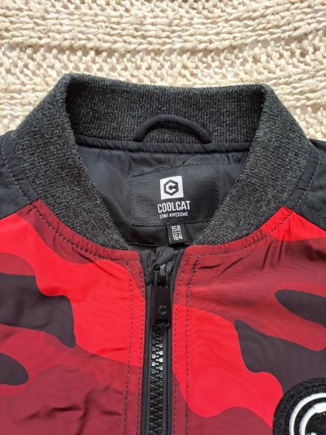 Podsita maskacova bunda s makkymi patentami, 158