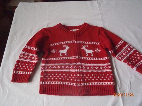 Tehlovočervený sveter, 98