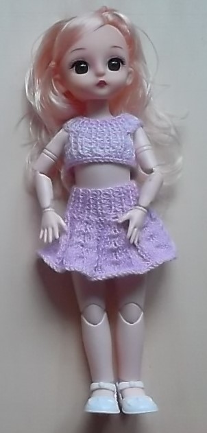 Bábika s oblečením,