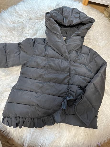 Prechodná  bunda s volanikmi, 110