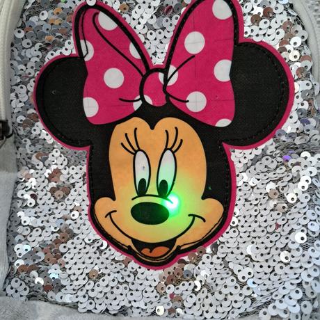 Blikajúci ruksak minie, 