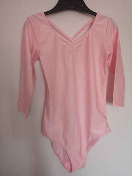 Svetloružový trikot z lesklého džerseja v. 122/128, 122