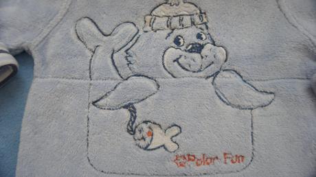 Mikinka s tuleňom, 74