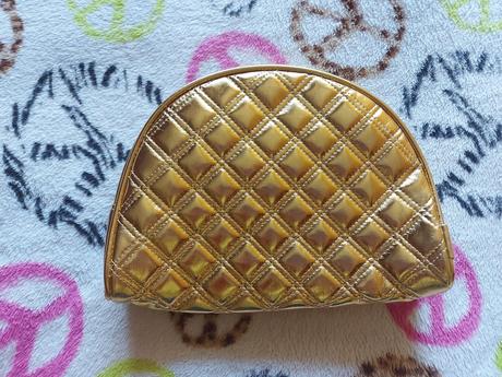Zlatá kozmetická taštička, 