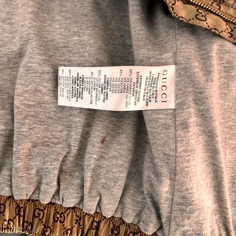 Gucci logo zlatá bunda s volánom a trikolórougucci, 104