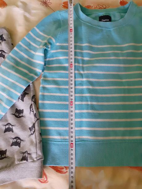 Baliček oblečenia, 122–134