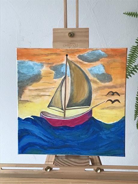 Maľba plachetnica pri západe slnka,